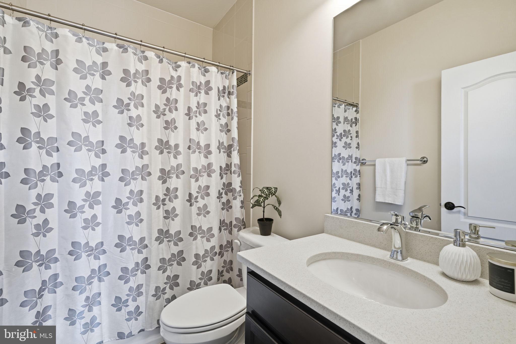 7821 Old Falls Road McLean, VA 22102 - Photo 39 of 62 a bathroom with a sink toilet and shower