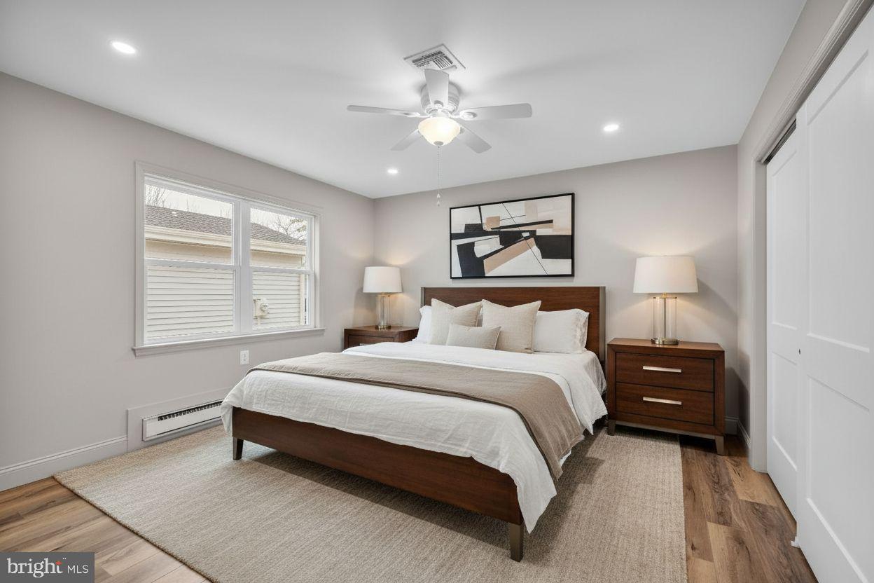 39 Chelsea Place Southampton, NJ 08088 - Photo 17 of 23 a bedroom with a bed and a painting