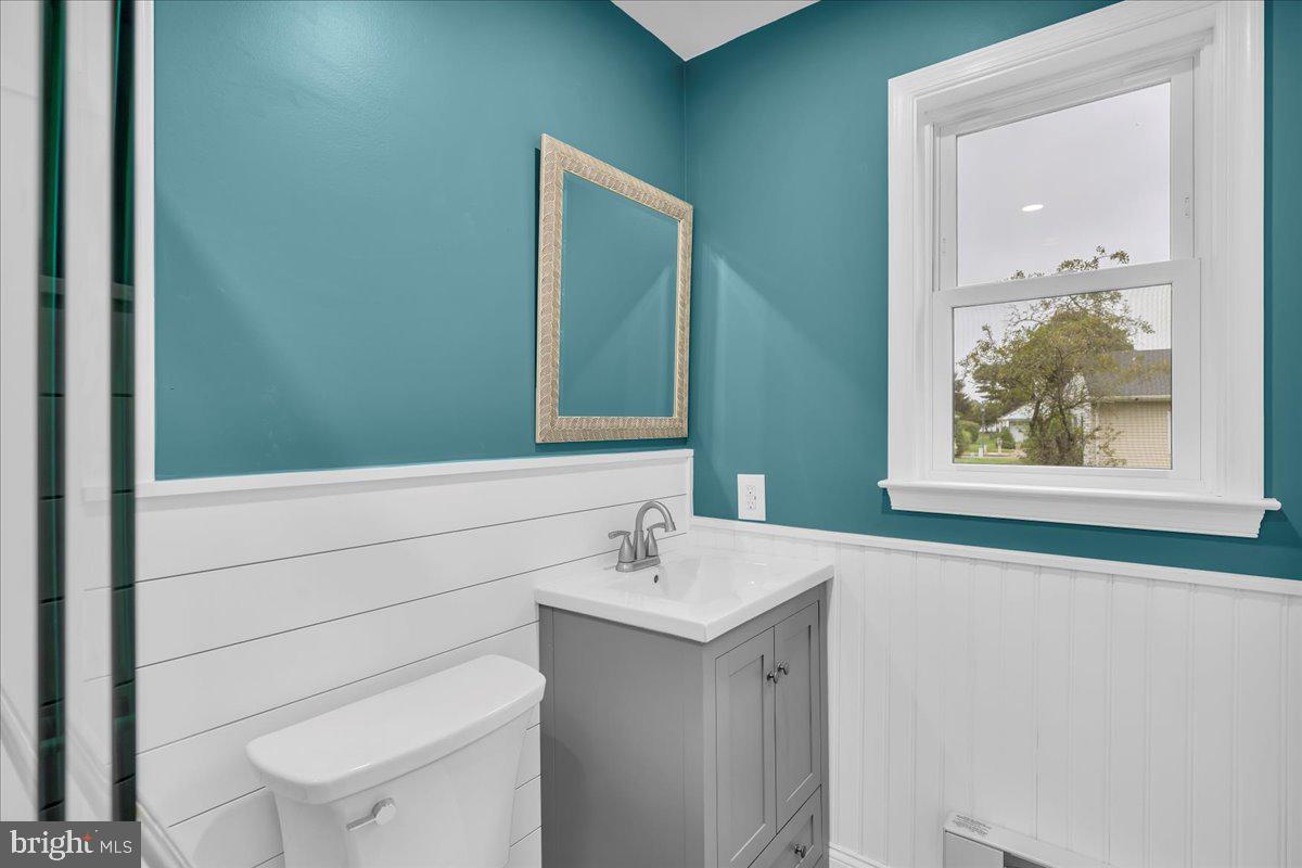 39 Chelsea Place Southampton, NJ 08088 - Photo 18 of 23 a bathroom with a toilet sink and mirror