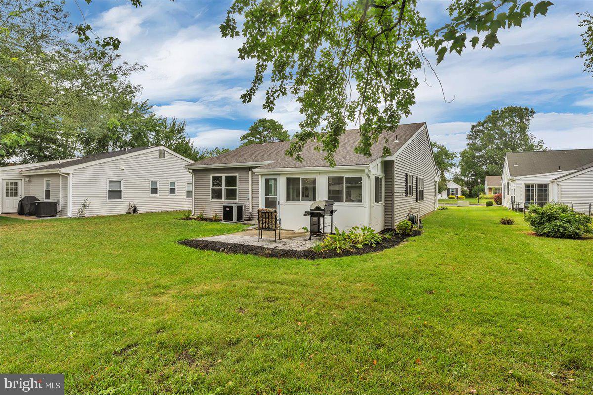39 Chelsea Place Southampton, NJ 08088 - Photo 23 of 23 a front view of a house with a yard table and chairs