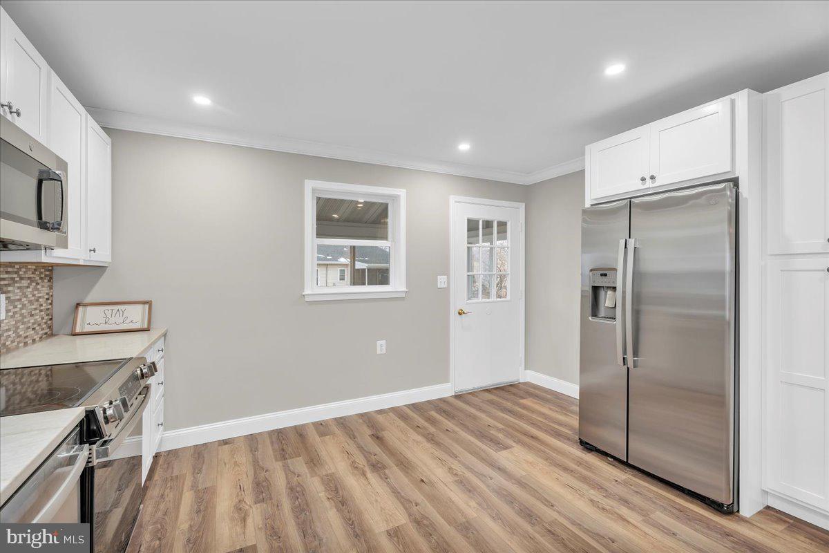 39 Chelsea Place Southampton, NJ 08088 - Photo 8 of 23 a view of kitchen with a sink refrigerator and wooden floor