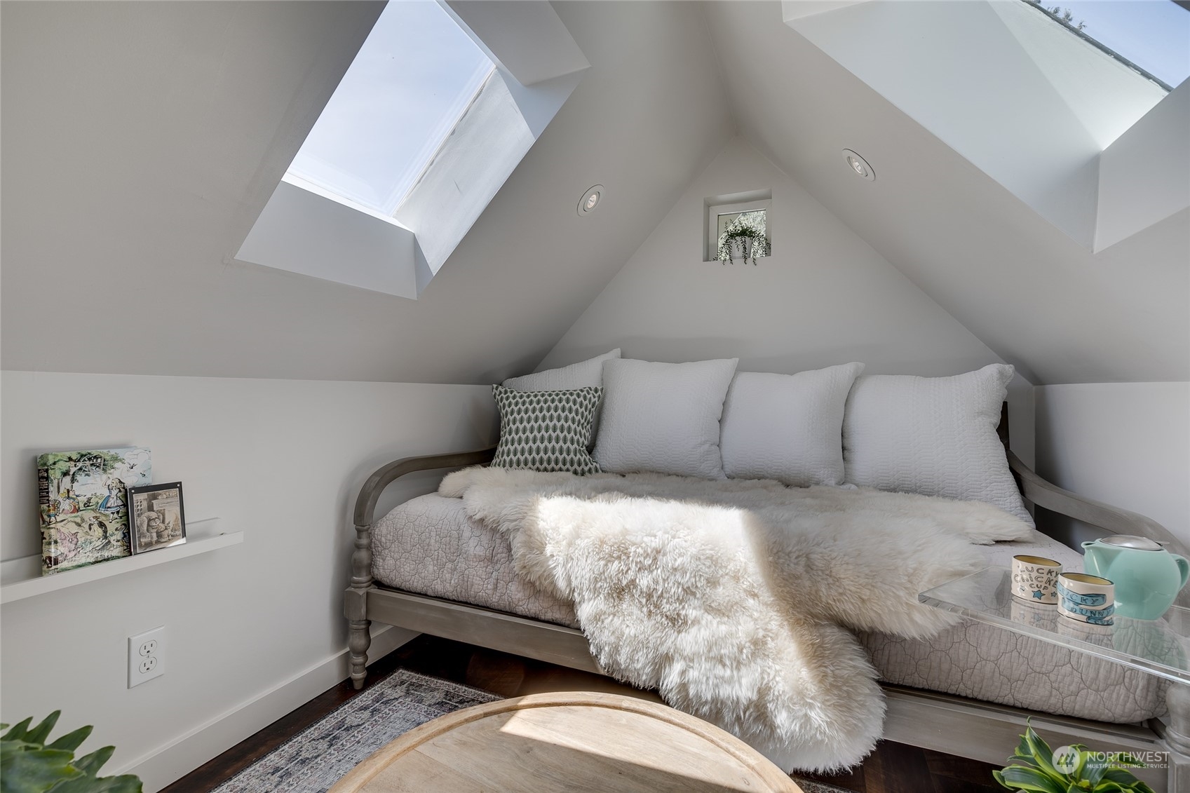 651 Northwest 89th Street Seattle, WA 98117 - Photo 12 of 38 a bedroom with a bed and a night stand