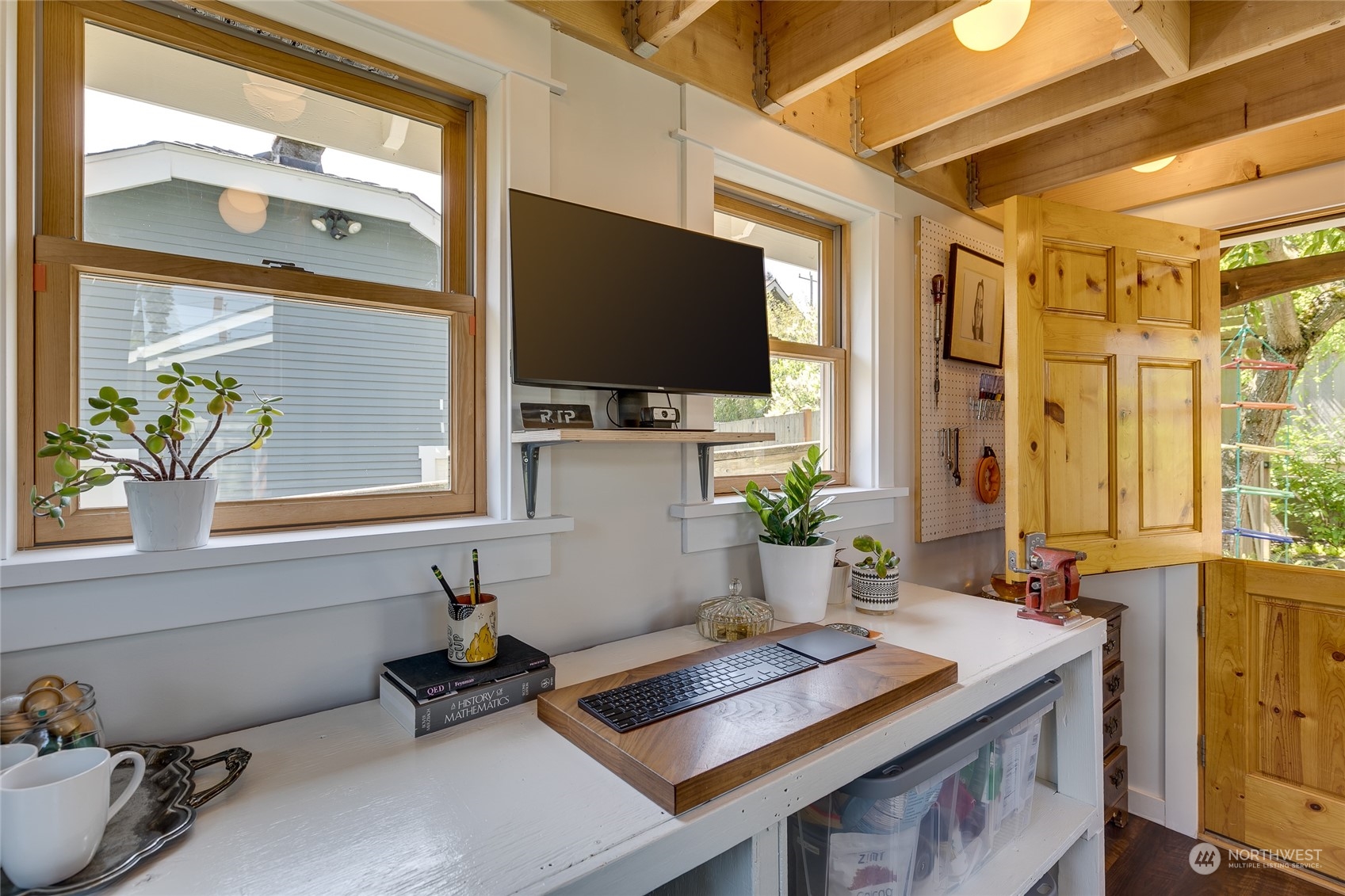 651 Northwest 89th Street Seattle, WA 98117 - Photo 13 of 38 a living room with furniture and a flat screen tv