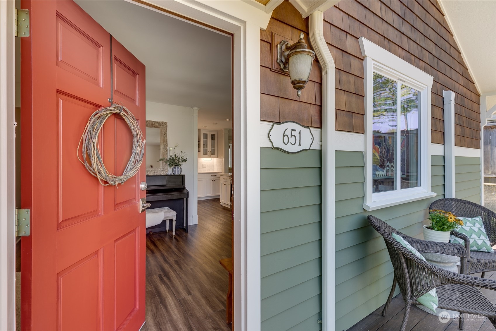 651 Northwest 89th Street Seattle, WA 98117 - Photo 16 of 38 a view of a room with chairs and wooden floor