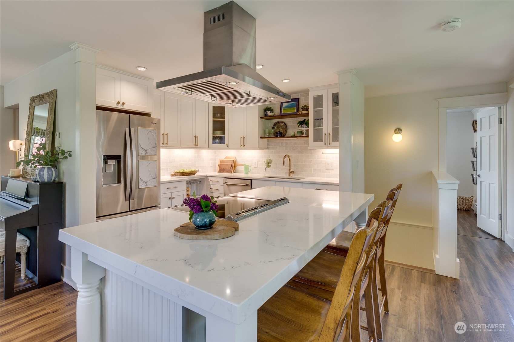 651 Northwest 89th Street Seattle, WA 98117 - Photo 20 of 38 a dining room with stainless steel appliances kitchen island granite countertop a dining table and chairs