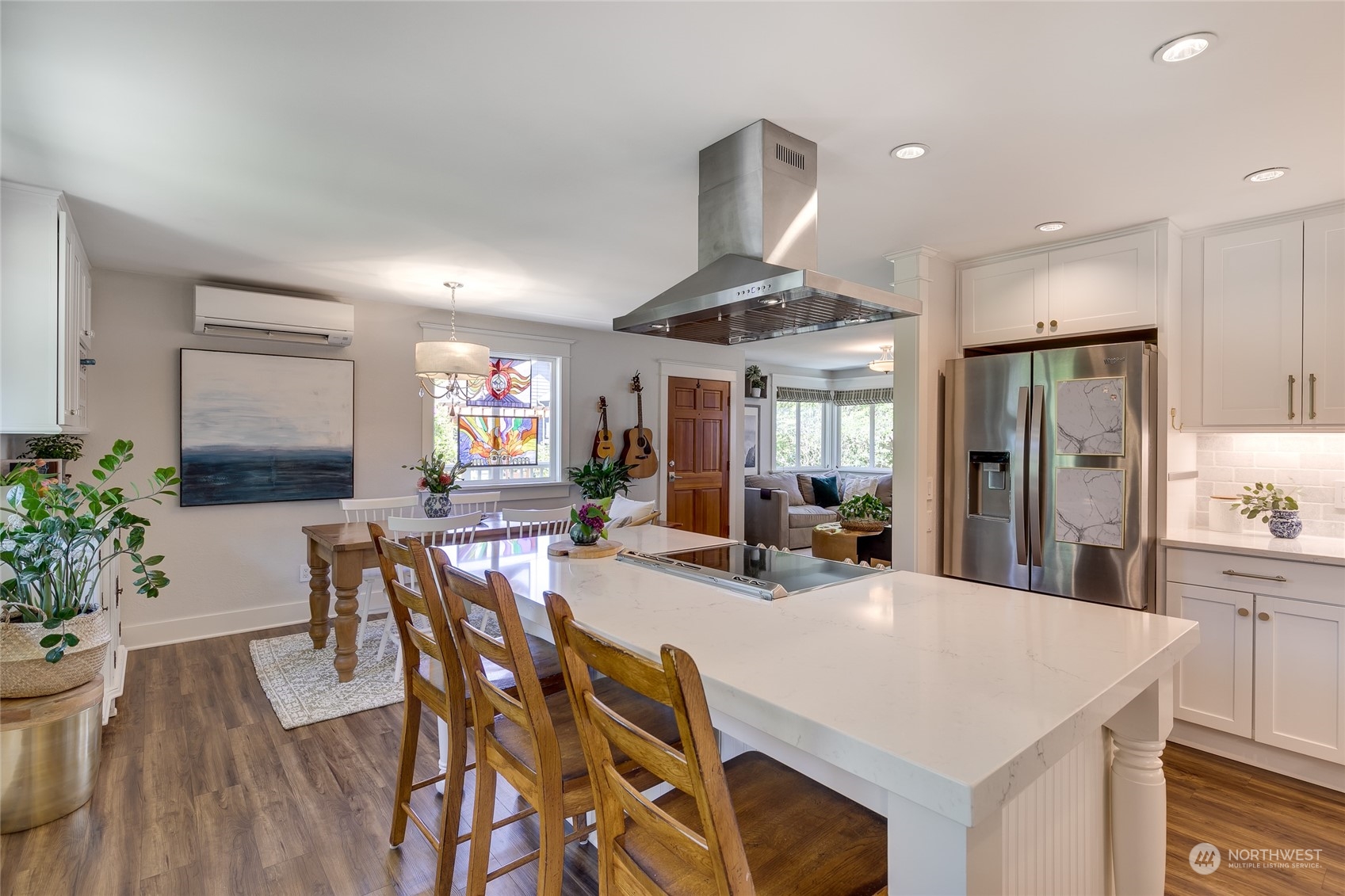 651 Northwest 89th Street Seattle, WA 98117 - Photo 21 of 38 a view of a dining room with furniture and wooden floor