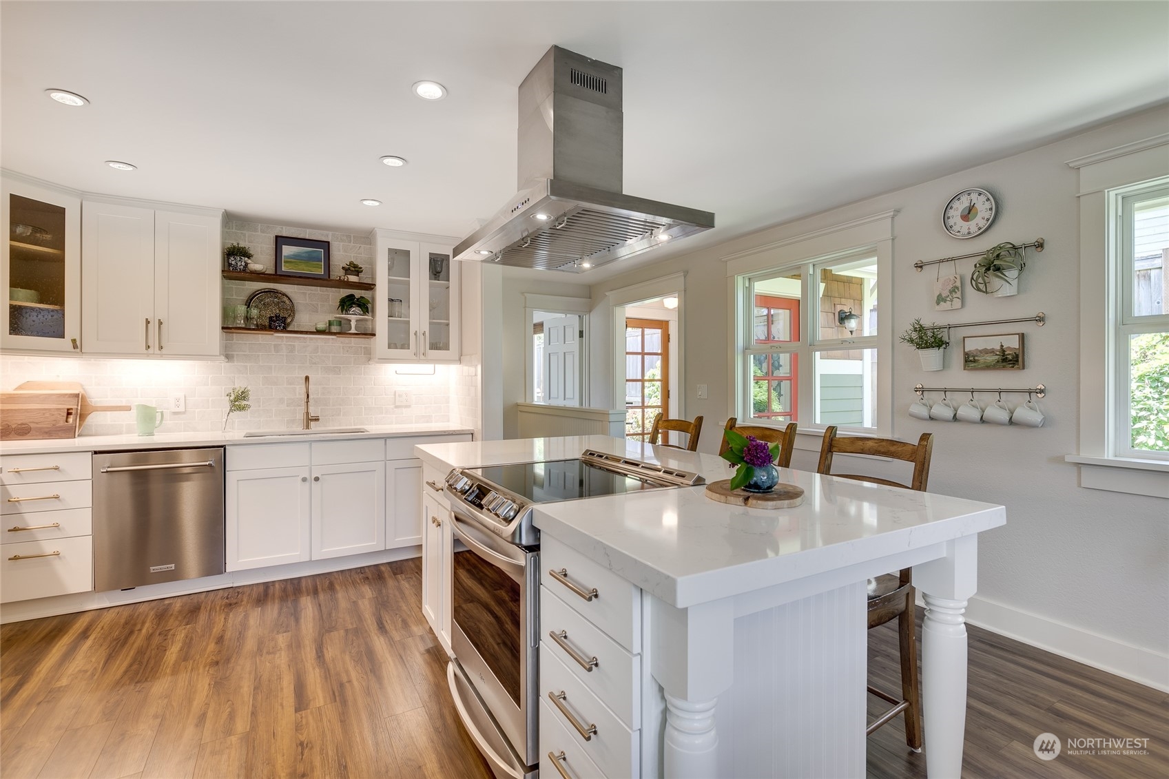 651 Northwest 89th Street Seattle, WA 98117 - Photo 22 of 38 a kitchen with a sink stove and cabinets