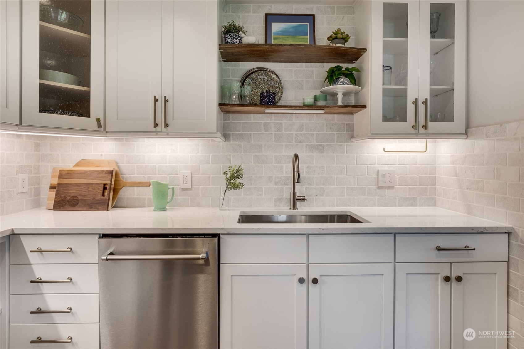651 Northwest 89th Street Seattle, WA 98117 - Photo 23 of 38 a kitchen with a sink and cabinets