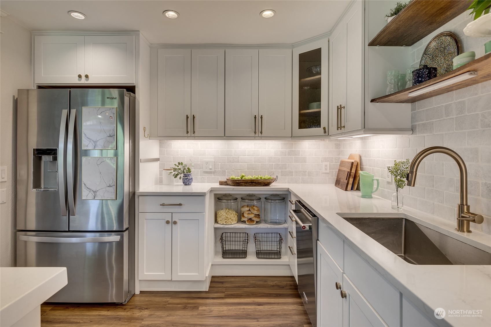 651 Northwest 89th Street Seattle, WA 98117 - Photo 24 of 38 a kitchen with a refrigerator and a sink