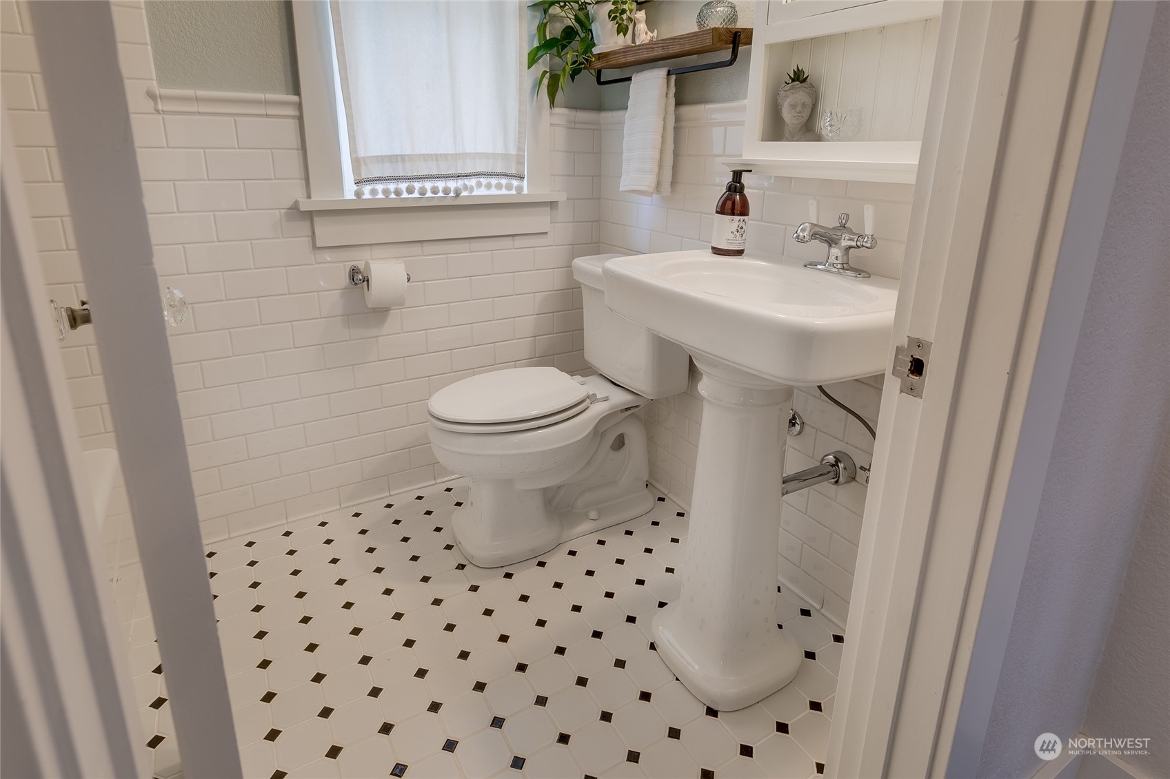 651 Northwest 89th Street Seattle, WA 98117 - Photo 27 of 38 a bathroom with a sink a toilet and a mirror