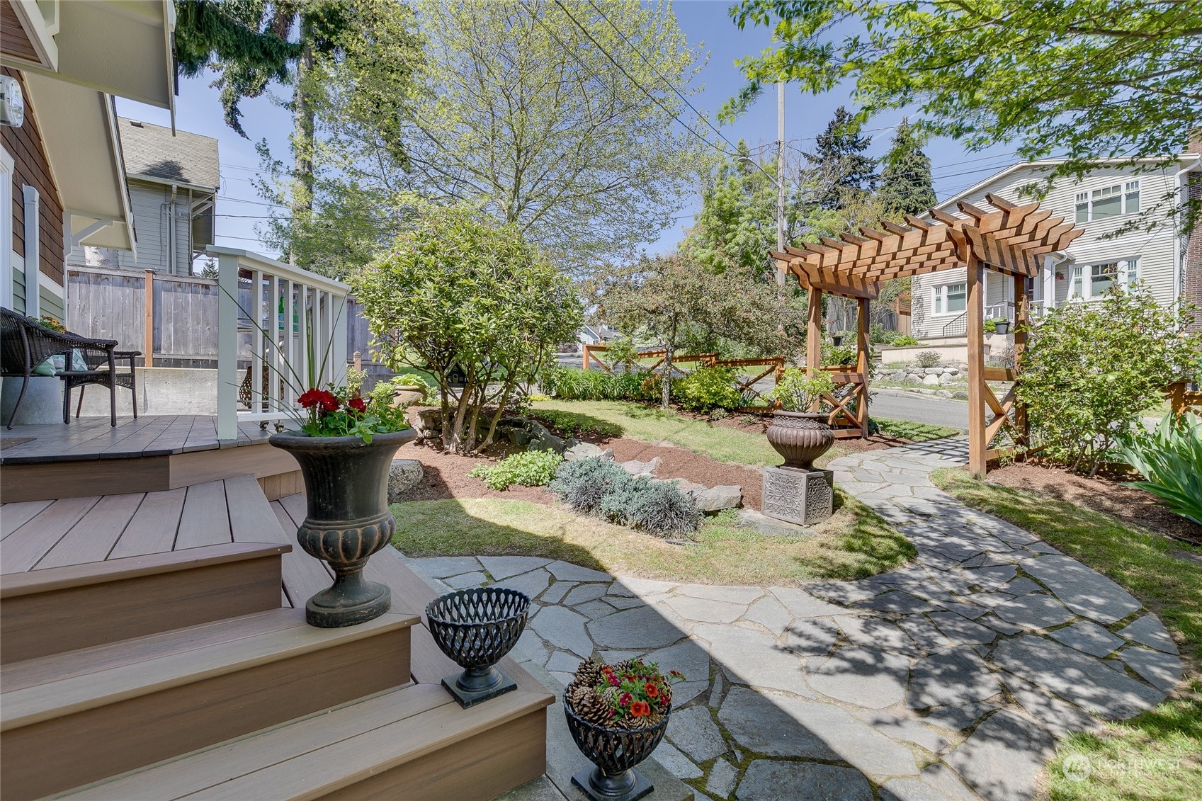 651 Northwest 89th Street Seattle, WA 98117 - Photo 3 of 38 a view of backyard with seating area and trees