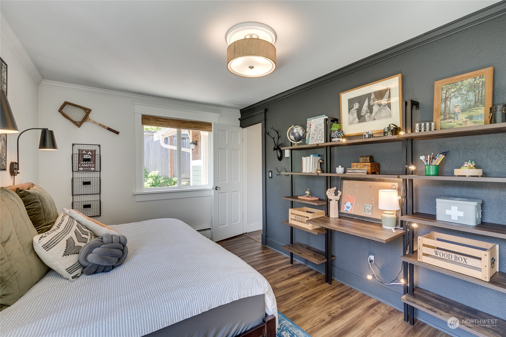 651 Northwest 89th Street Seattle, WA 98117 - Photo 31 of 38 a bedroom with a bed and a book shelf