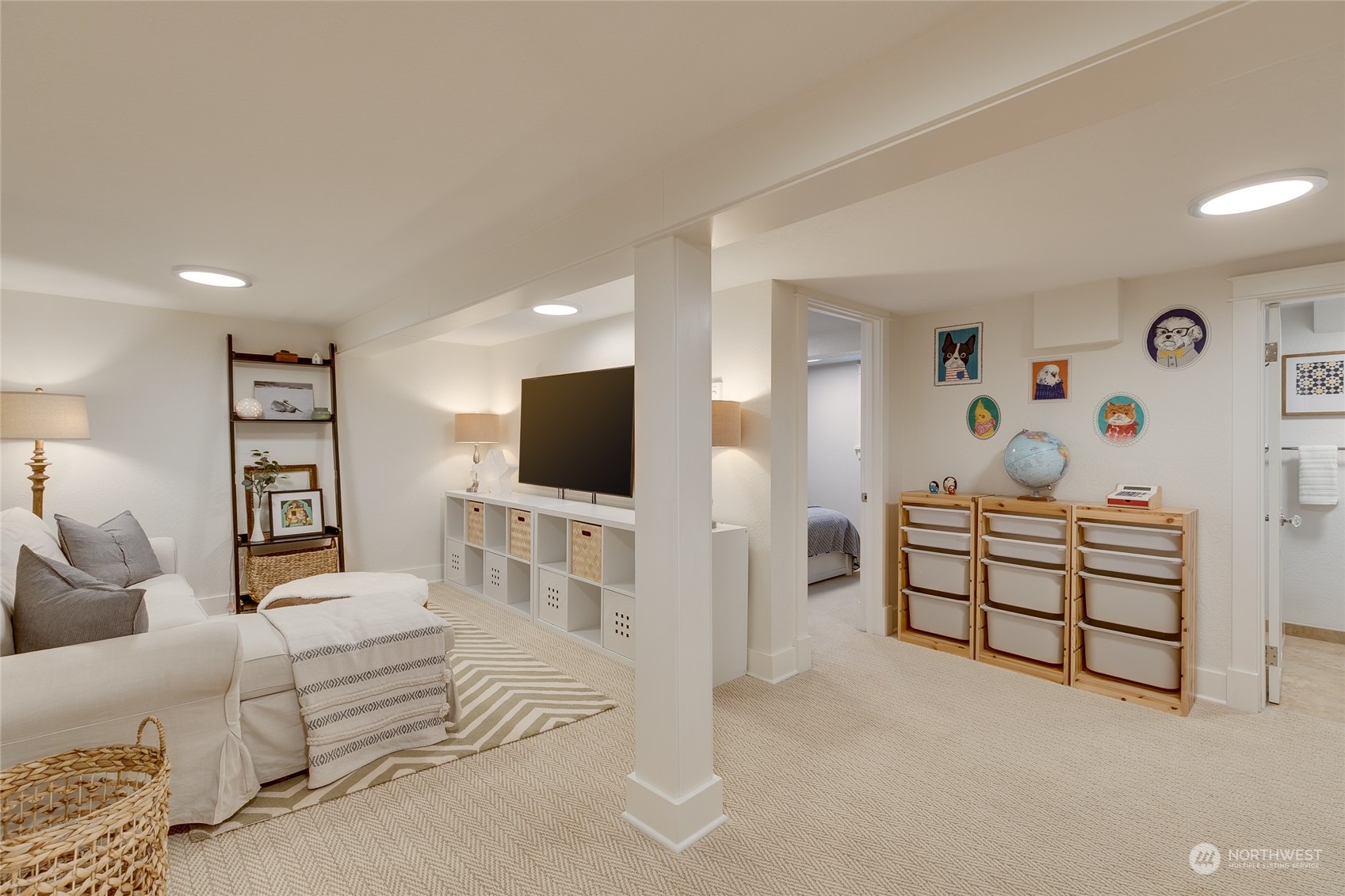 651 Northwest 89th Street Seattle, WA 98117 - Photo 33 of 38 a bedroom with furniture and a flat screen tv