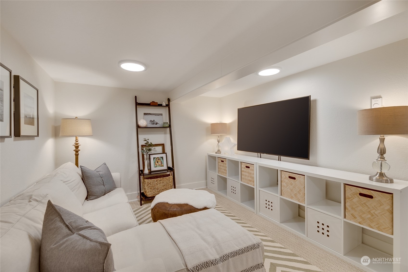 651 Northwest 89th Street Seattle, WA 98117 - Photo 34 of 38 a living room with furniture and a flat screen tv