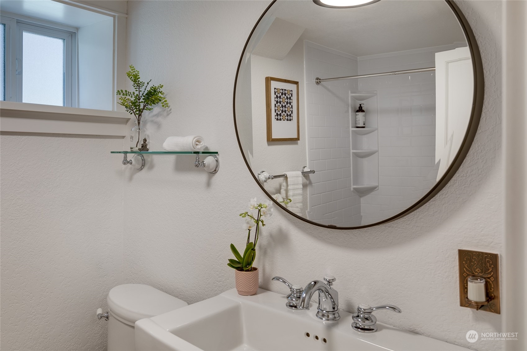 651 Northwest 89th Street Seattle, WA 98117 - Photo 37 of 38 a bathroom with a sink and mirror with bathtub