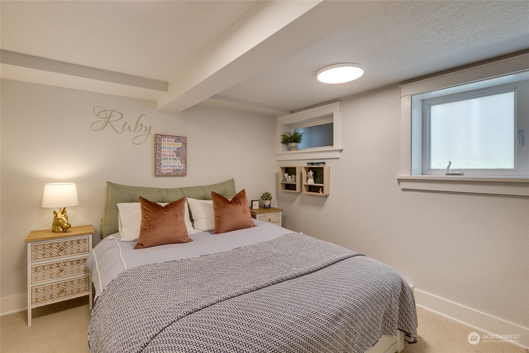 651 Northwest 89th Street Seattle, WA 98117 - Photo 38 of 38 a bedroom with a bed and a night stand