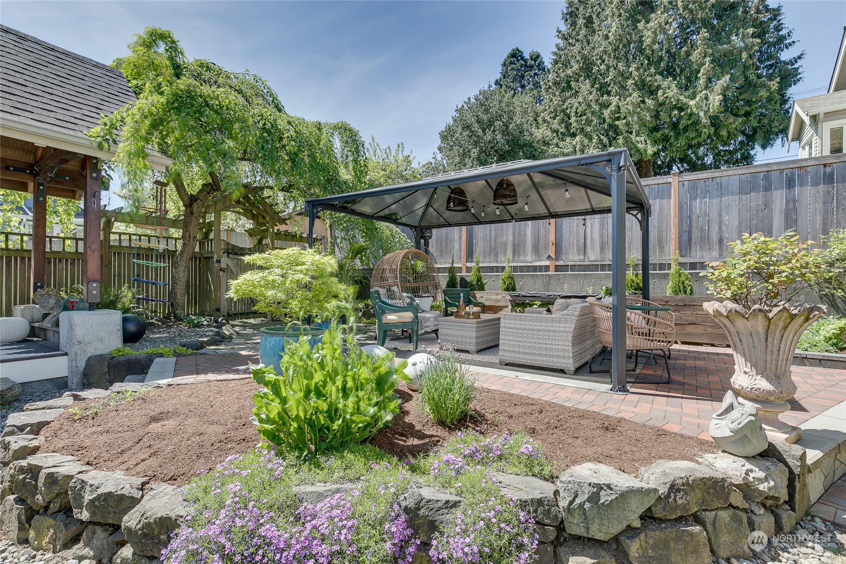 651 Northwest 89th Street Seattle, WA 98117 - Photo 8 of 38 a view of a backyard with sitting area and furniture