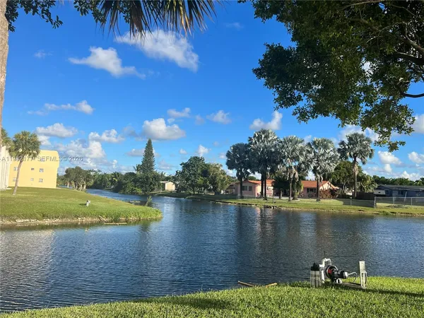 a view of a lake with a yard