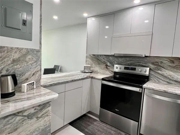 a kitchen with a stove and a sink