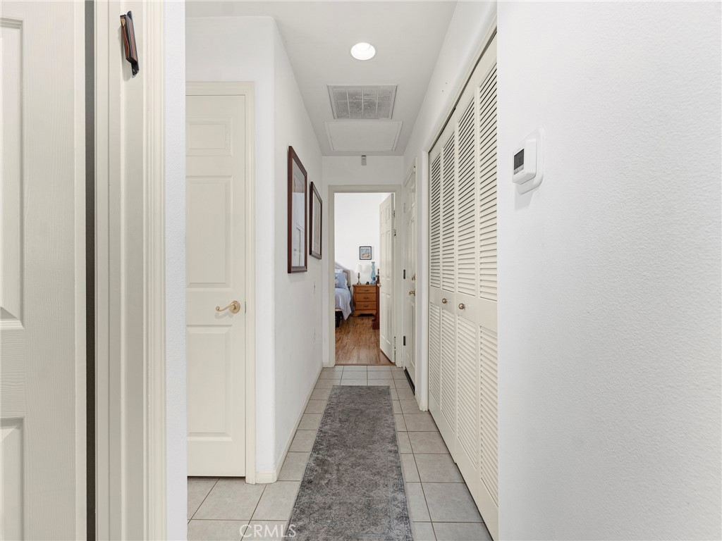 5621 Daisy Street Simi Valley, CA 93063 - Photo 18 of 31 a view of a hallway with wooden shelves
