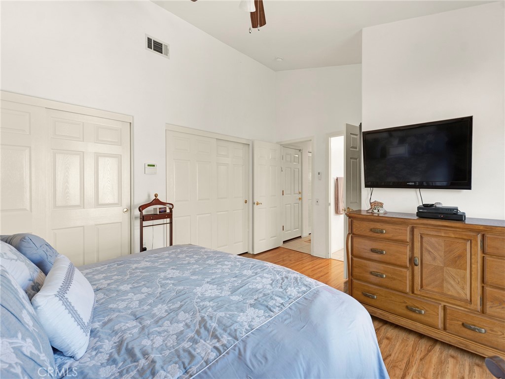 5621 Daisy Street Simi Valley, CA 93063 - Photo 19 of 31 a bedroom with a bed and a flat screen tv in it