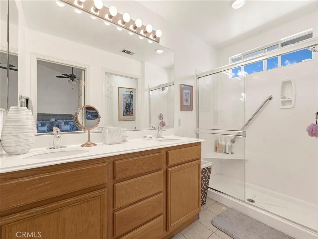 5621 Daisy Street Simi Valley, CA 93063 - Photo 20 of 31 a bathroom with a double vanity sink mirror and double