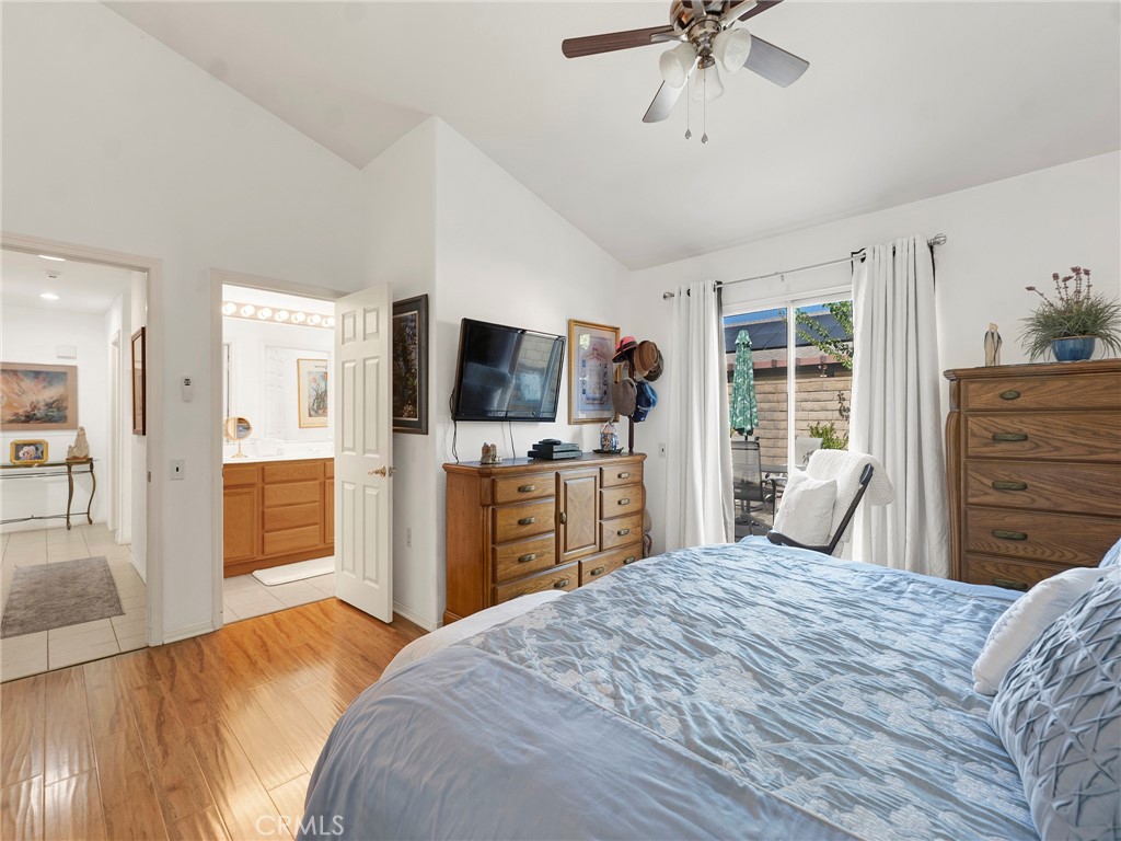 5621 Daisy Street Simi Valley, CA 93063 - Photo 23 of 31 a bedroom with a large bed a flat tv screen and dresser