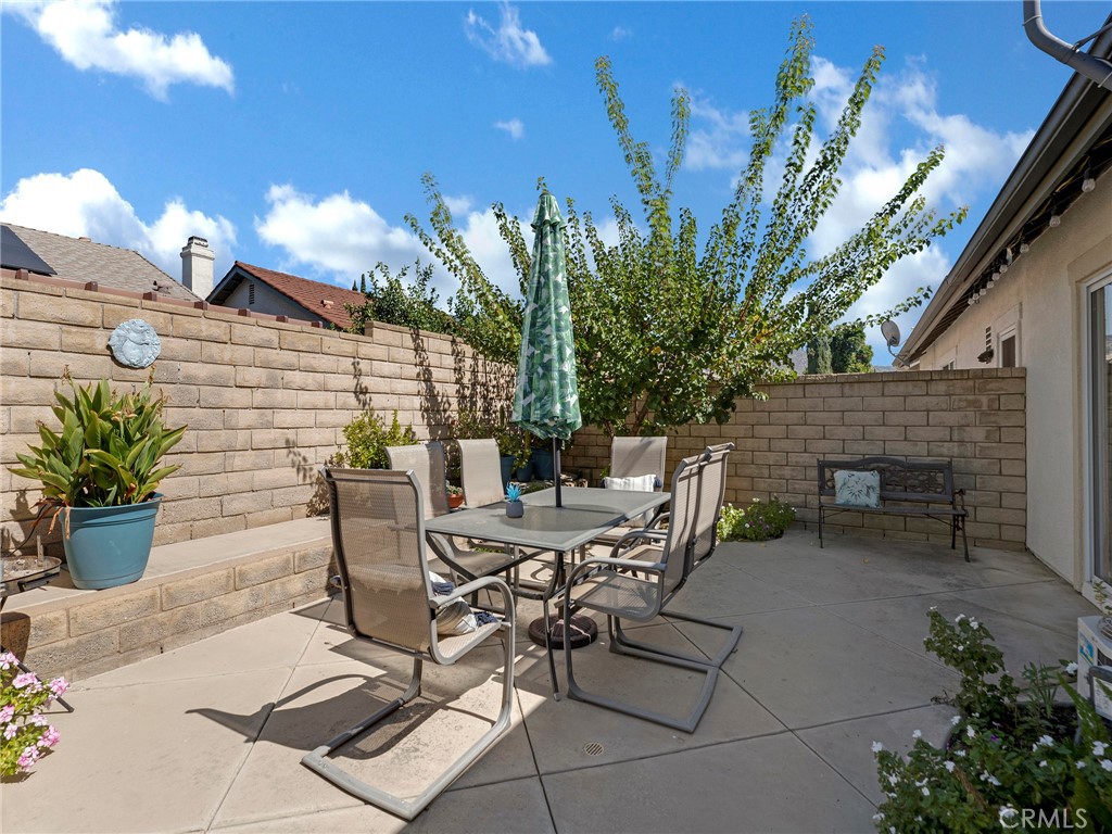 5621 Daisy Street Simi Valley, CA 93063 - Photo 26 of 31 a view of a patio with table and chairs and potted plants