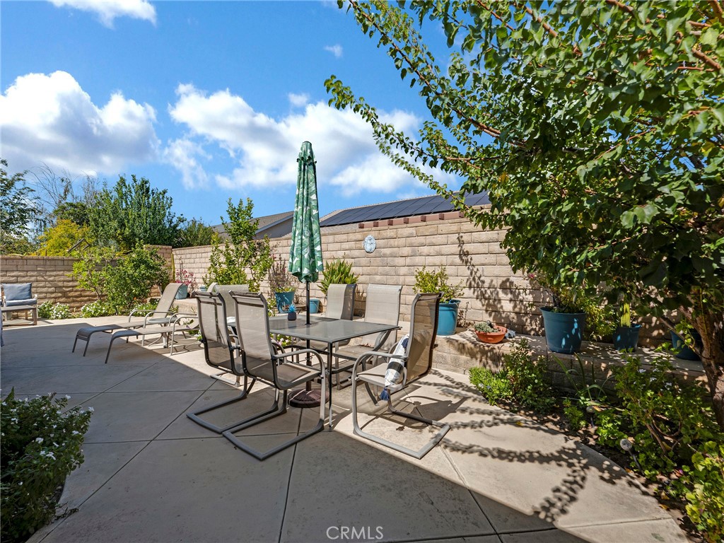 5621 Daisy Street Simi Valley, CA 93063 - Photo 27 of 31 a view of a patio with table and chairs and potted plants