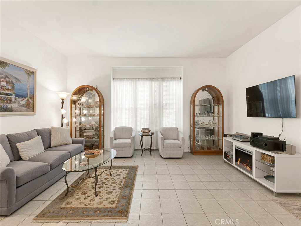 5621 Daisy Street Simi Valley, CA 93063 - Photo 7 of 31 a living room with furniture and a flat screen tv