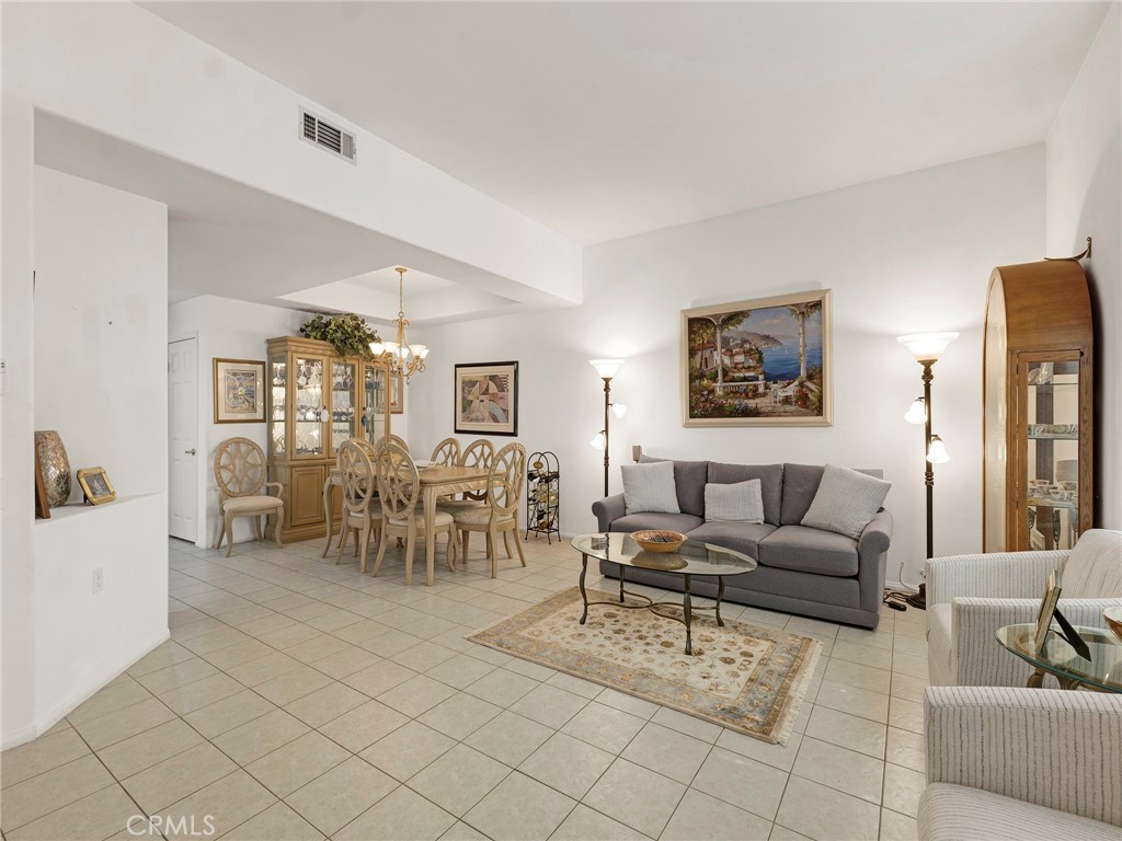 5621 Daisy Street Simi Valley, CA 93063 - Photo 8 of 31 a living room with furniture and a dining table with chairs