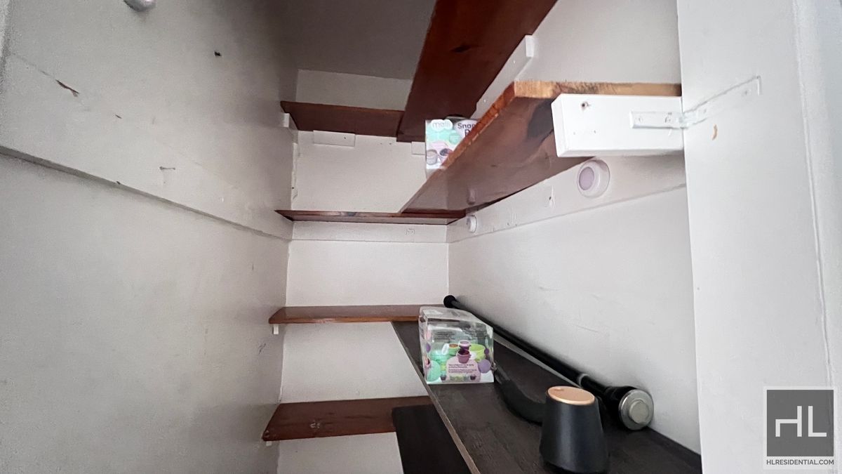 2070 East 55th Street, Unit 2 Brooklyn, NY 11234 - Photo 15 of 23 a view of walk in closet with clothes and shoes