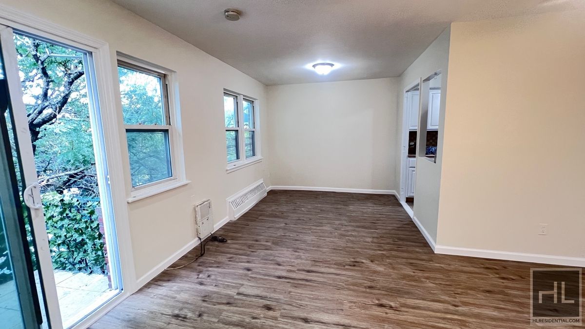 2070 East 55th Street, Unit 2 Brooklyn, NY 11234 - Photo 3 of 23 a view of an entryway with wooden floor and door