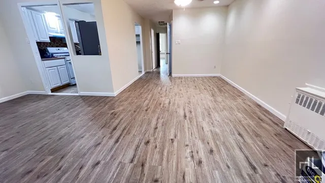 a view of kitchen and wooden floor
