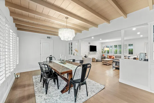 a view of a dining room with furniture and window