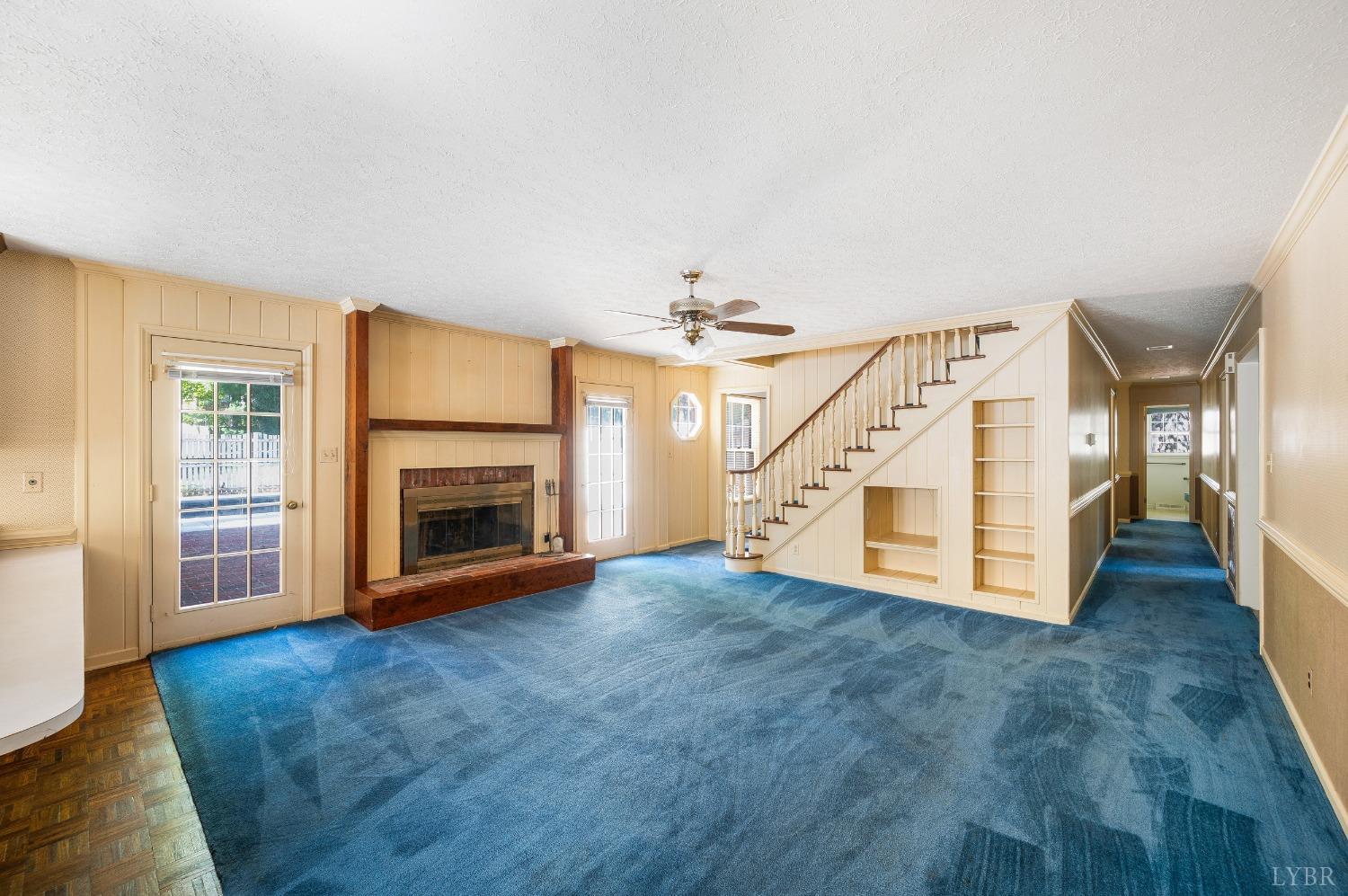 101 Foxhall Drive Forest, VA 24551 - Photo 20 of 54 a view of an empty room with wooden floor fireplace and a window
