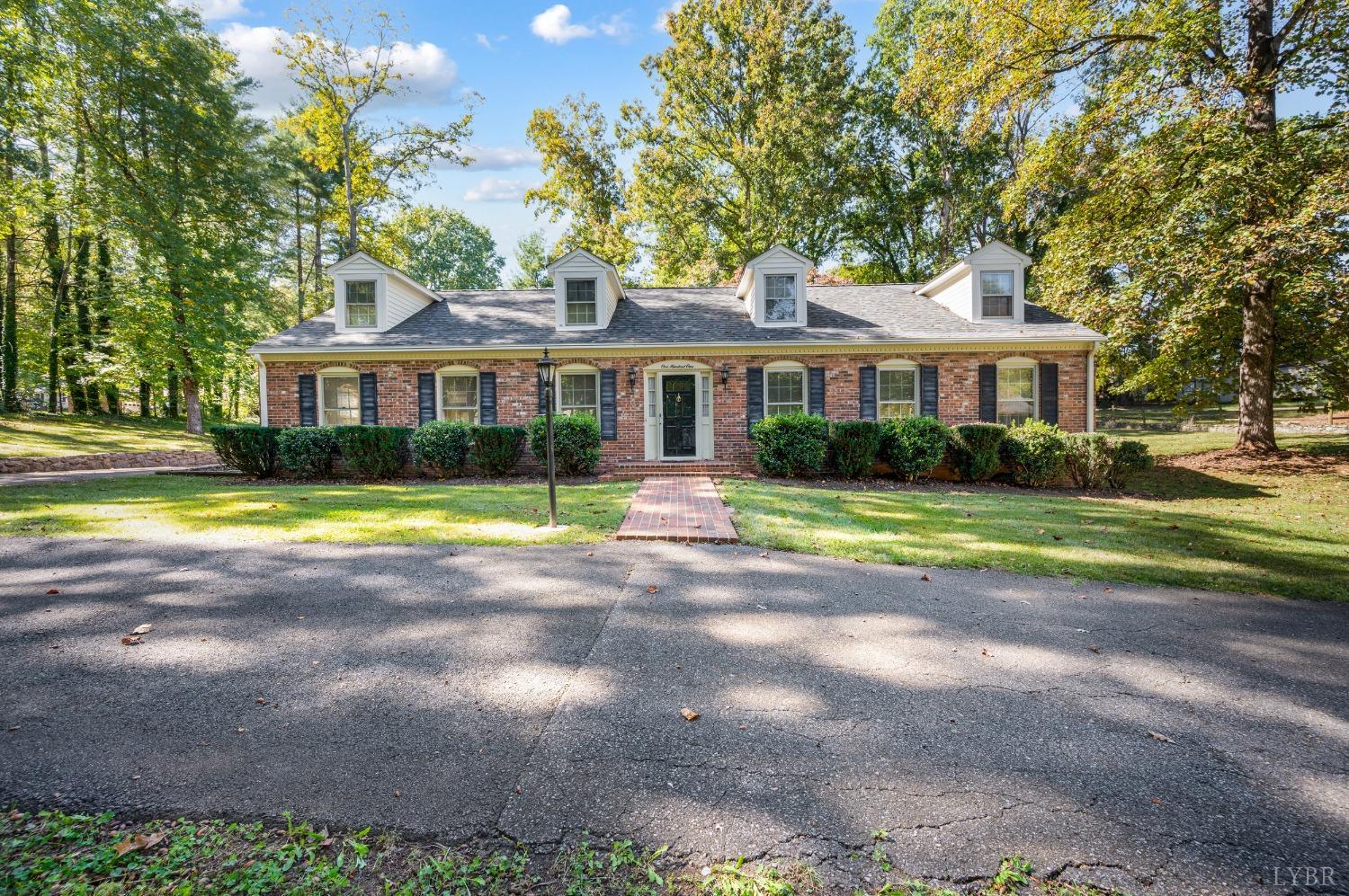 101 Foxhall Drive Forest, VA 24551 - Photo 2 of 54 a front view of a house with a garden