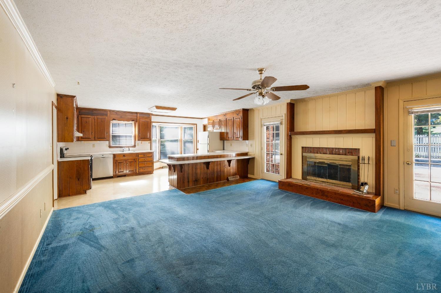 101 Foxhall Drive Forest, VA 24551 - Photo 21 of 54 a view of kitchen with furniture and a fireplace