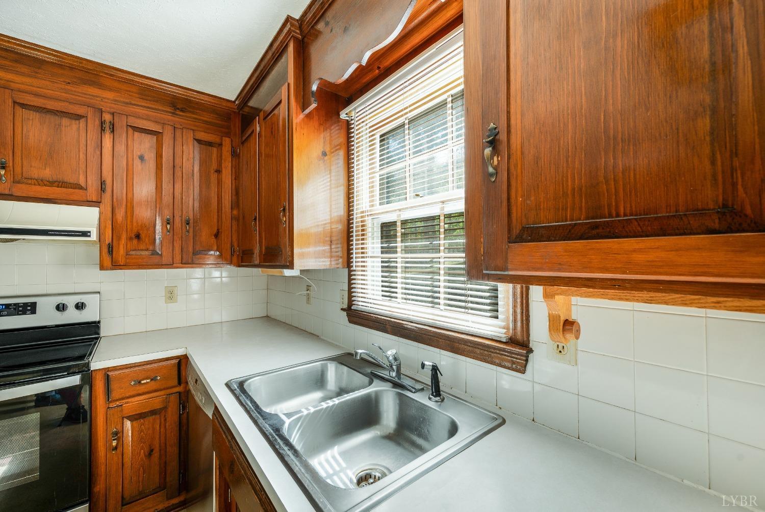 101 Foxhall Drive Forest, VA 24551 - Photo 24 of 54 a kitchen with a sink cabinets and window