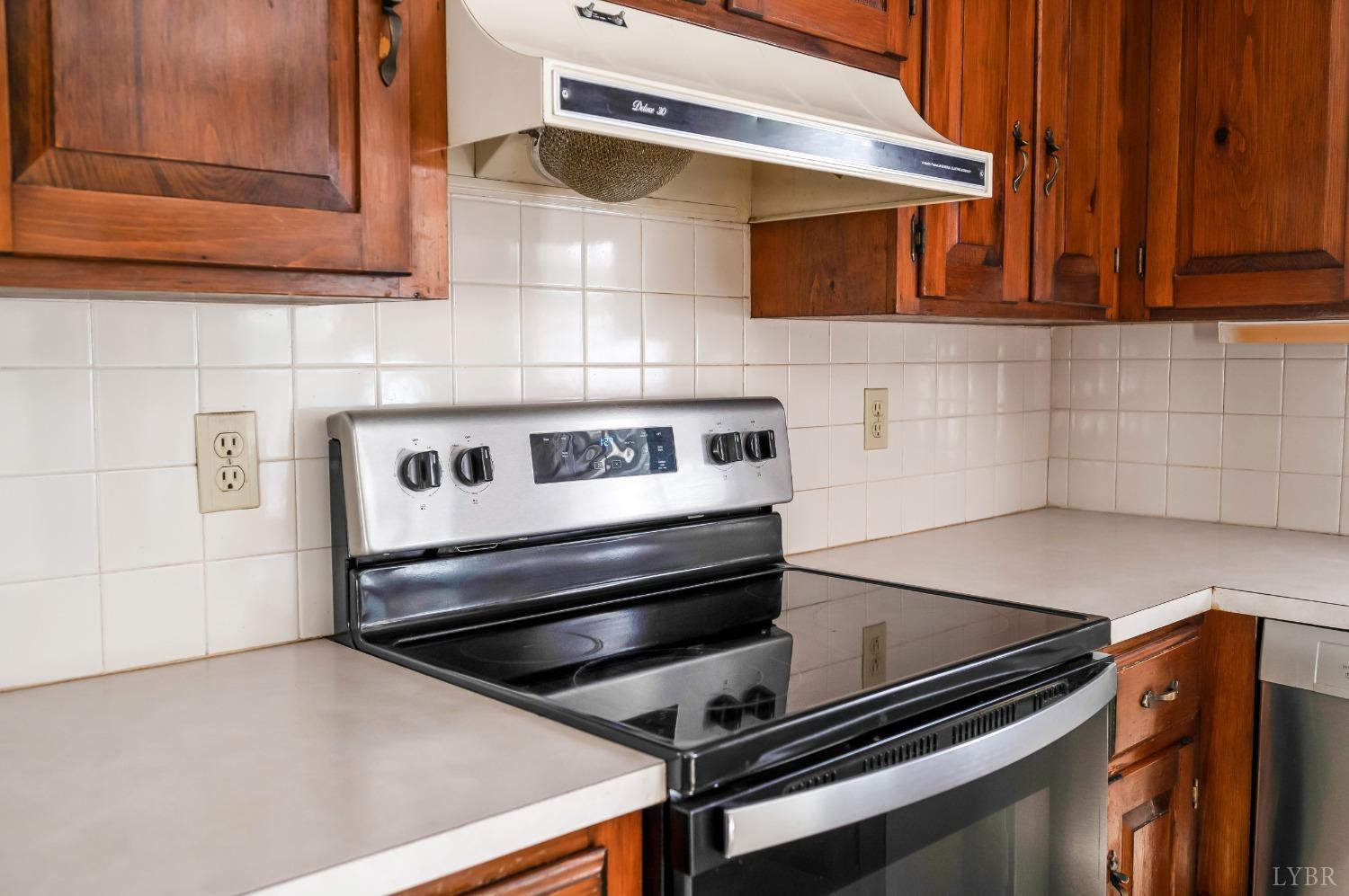 101 Foxhall Drive Forest, VA 24551 - Photo 25 of 54 a stove top oven sitting inside of a kitchen