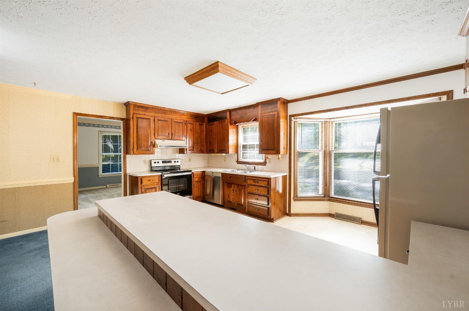 101 Foxhall Drive Forest, VA 24551 - Photo 26 of 54 a large kitchen with a large counter top a sink and stainless steel appliances