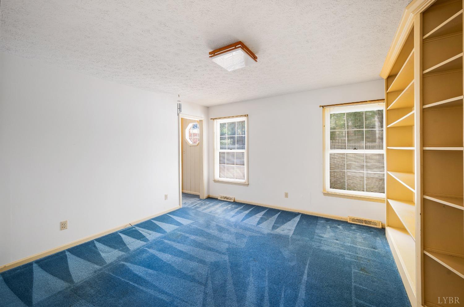 101 Foxhall Drive Forest, VA 24551 - Photo 29 of 54 an empty room with wooden floor and windows