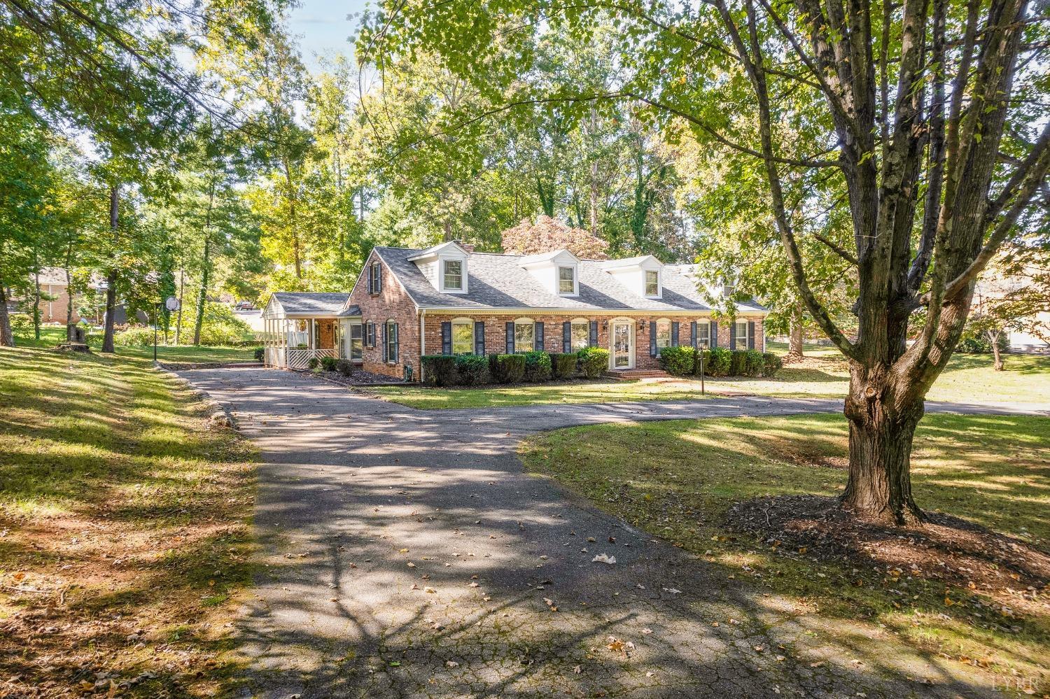 101 Foxhall Drive Forest, VA 24551 - Photo 3 of 54 a front view of a house with a yard