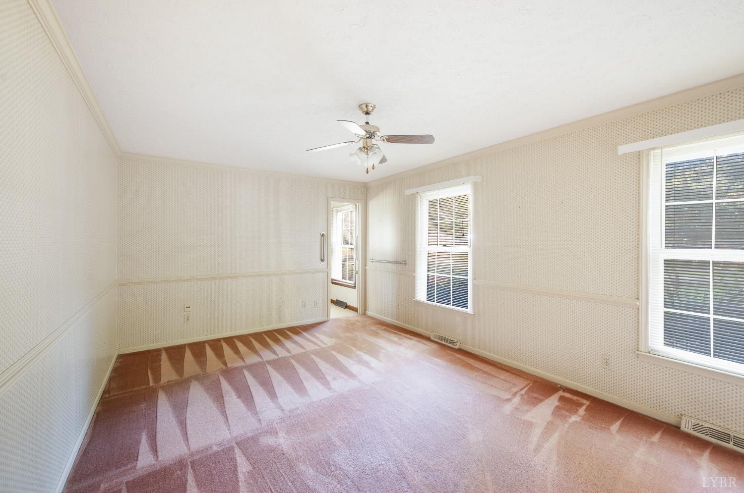 101 Foxhall Drive Forest, VA 24551 - Photo 33 of 54 an empty room with windows and chandelier fan