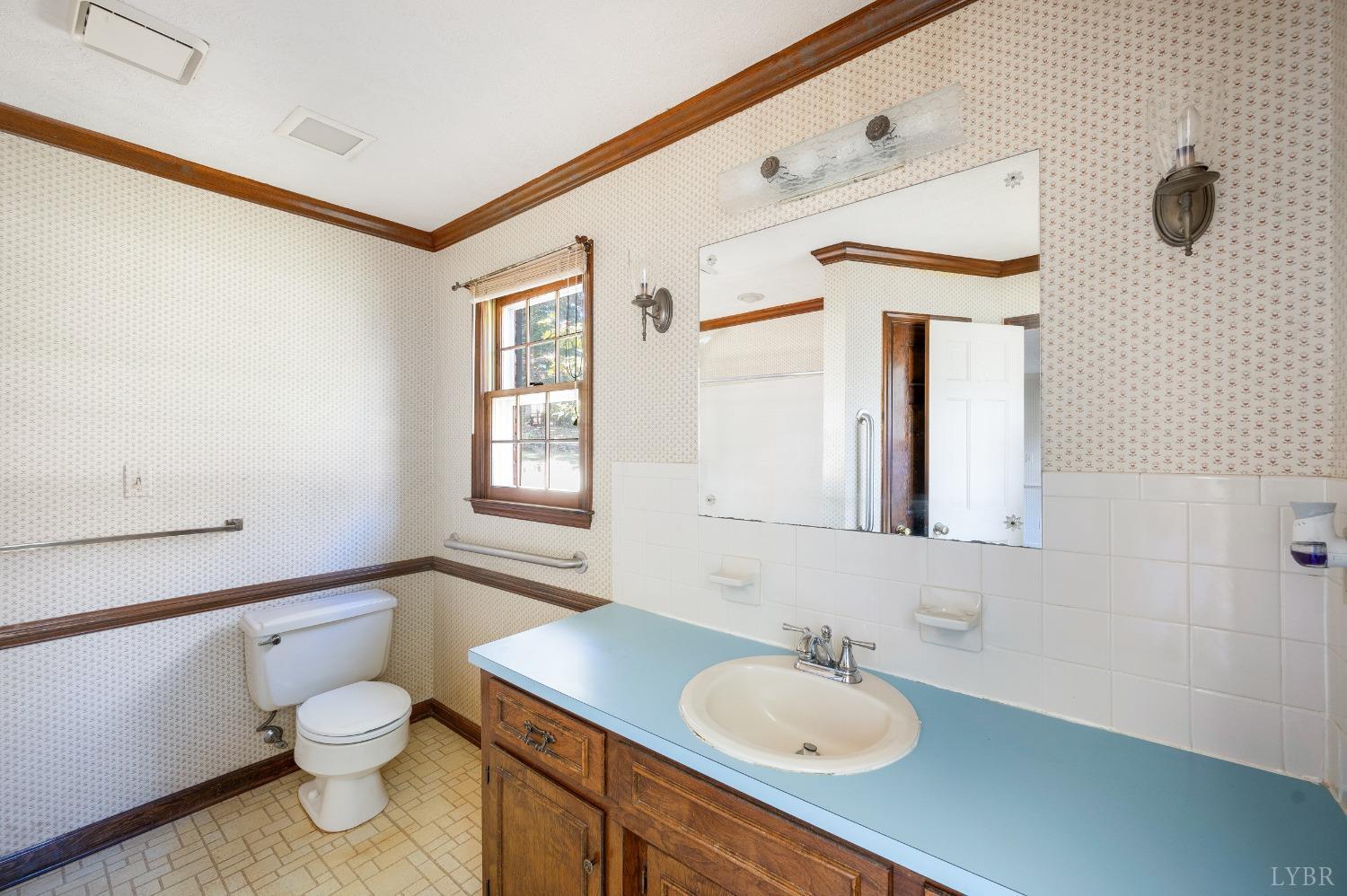 101 Foxhall Drive Forest, VA 24551 - Photo 35 of 54 a bathroom with a toilet sink and mirror