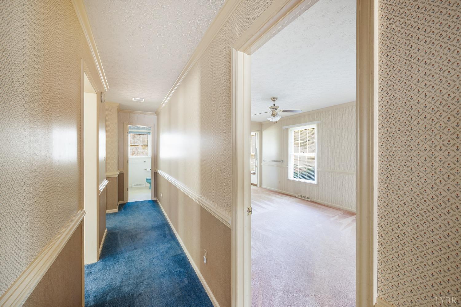 101 Foxhall Drive Forest, VA 24551 - Photo 51 of 54 a view of a hallway with wooden floor and staircase