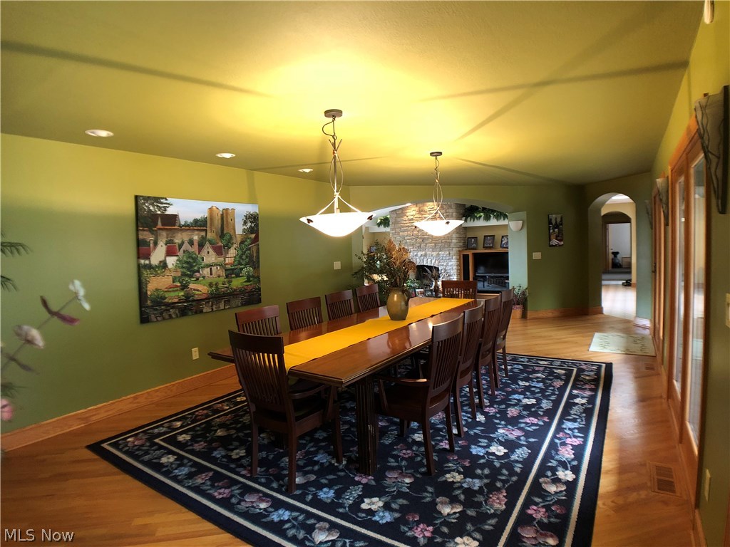 5014 Wayland Road Diamond, OH 44412 - Photo 5 of 29 Large dining room with three doors leading straight into the rear deck and patio area.