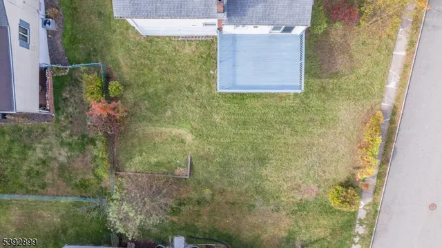 an aerial view of a house with a garden