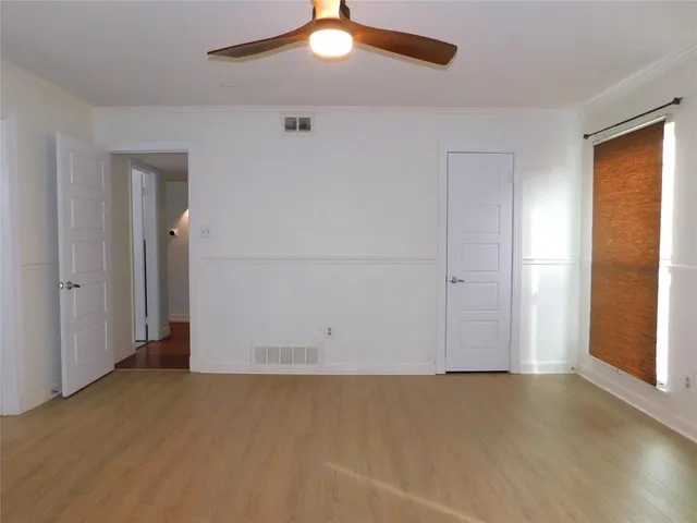 an empty room with a empty space and a window