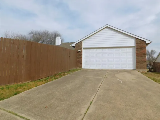 a view of garage and yard